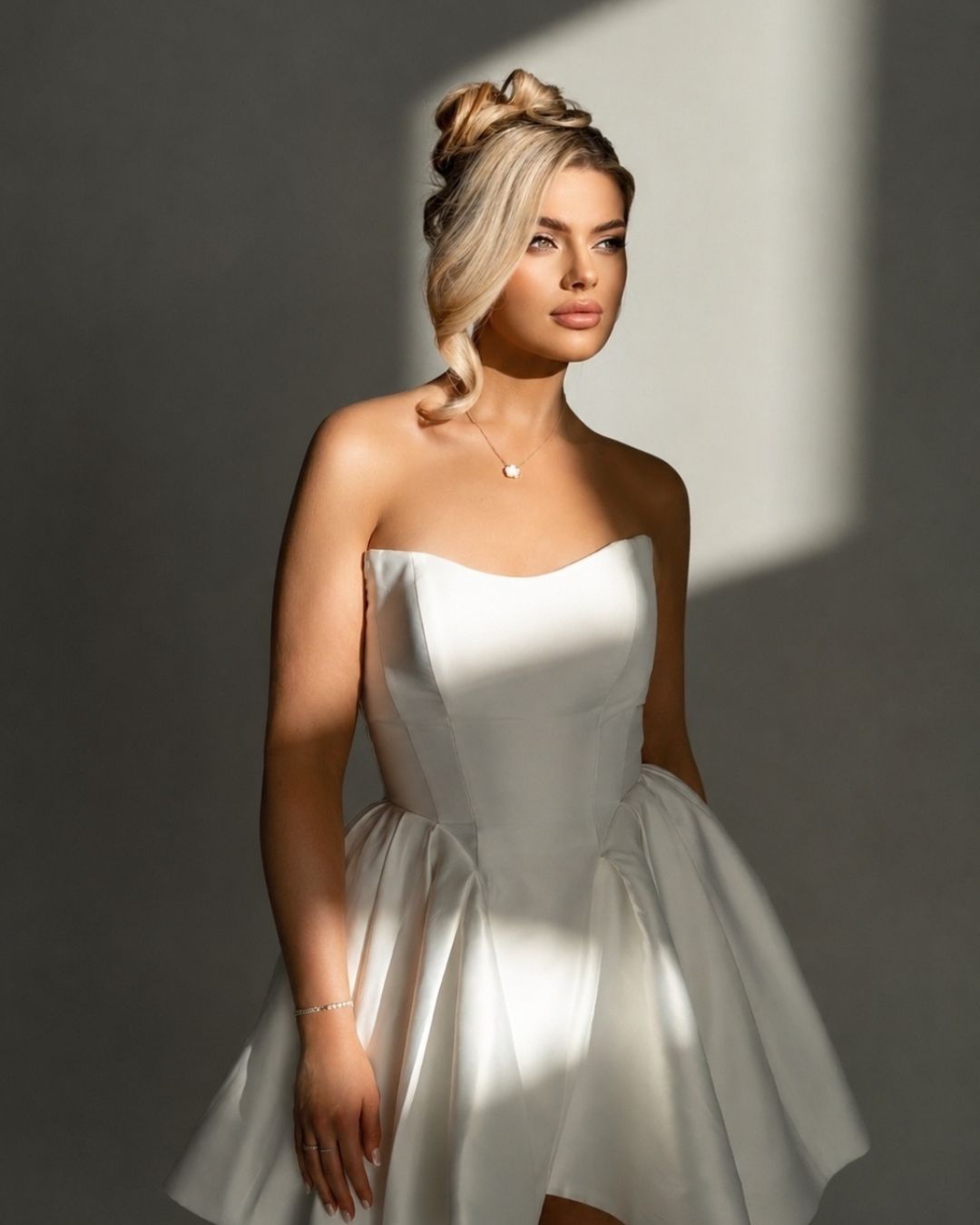 Bride with elegant upstyle and soft bridal makeup by Katherine Art Makeup in Queensland