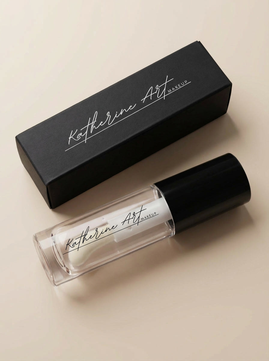 Katherine Art Makeup clear lip gloss shade "Dream Bubble" with black luxury packaging on neutral background
