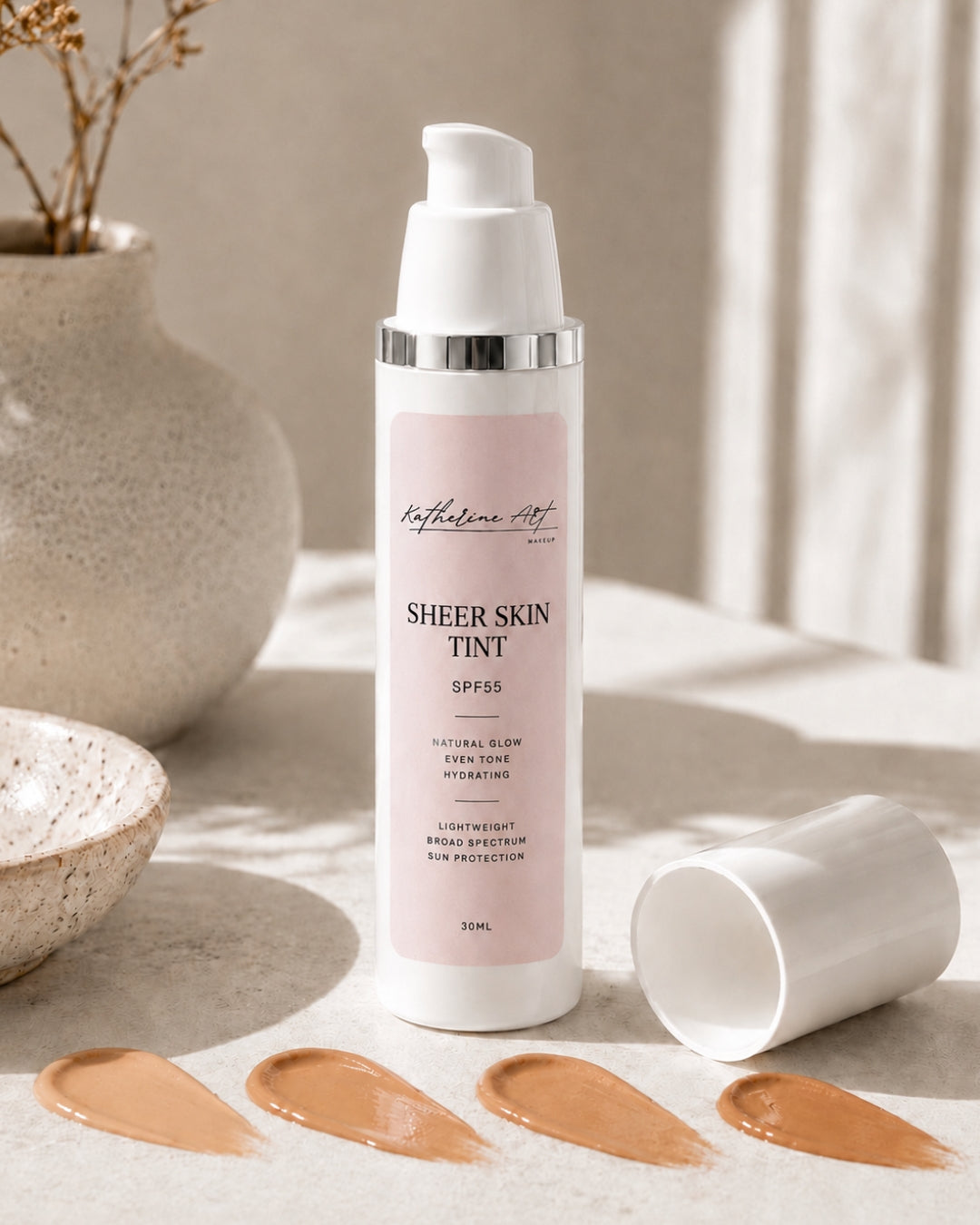 Katherine Art Sheer Skin Tint SPF55 in a 30ml bottle with four shade swatches, showcasing a lightweight hydrating skin tint with a natural glow finish and broad spectrum sun protection.